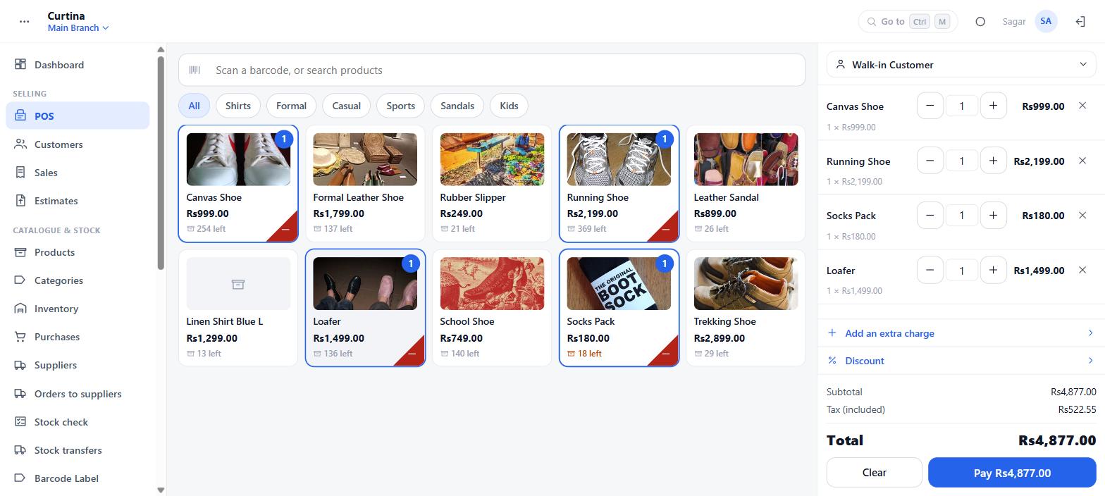The browser till mid-bill: a grid of items with the stock left on each, and a running bill on the right with four lines, an extra charge, a discount and the total.